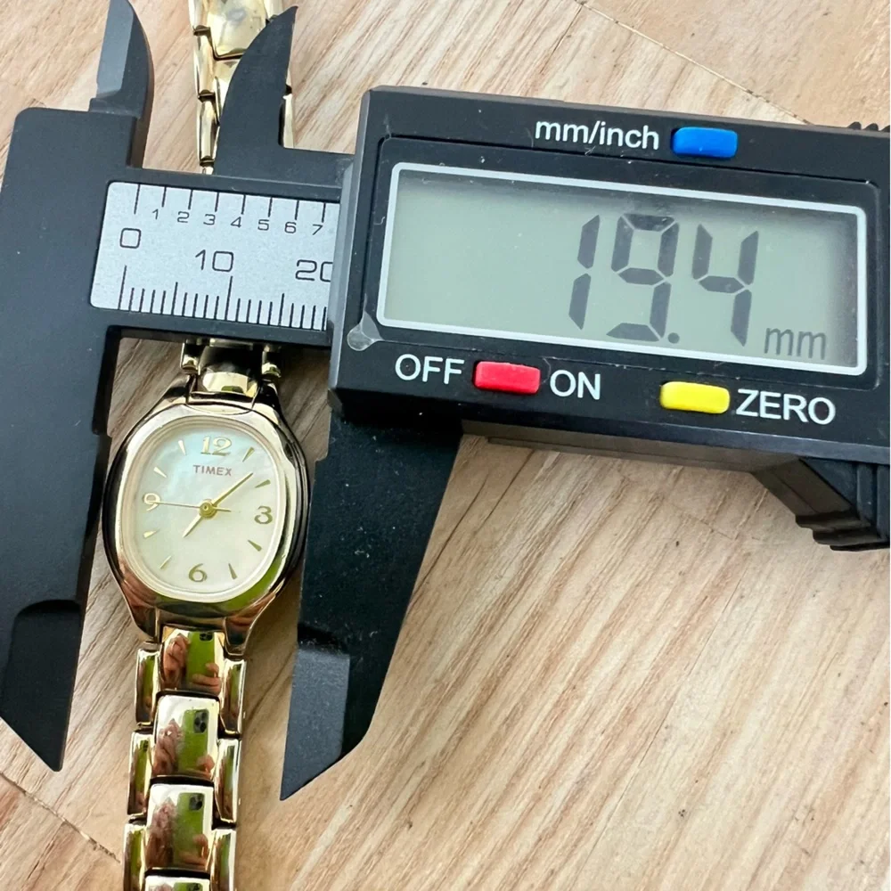 Timex ladies oval gold tone dress watch NEW BATTERY